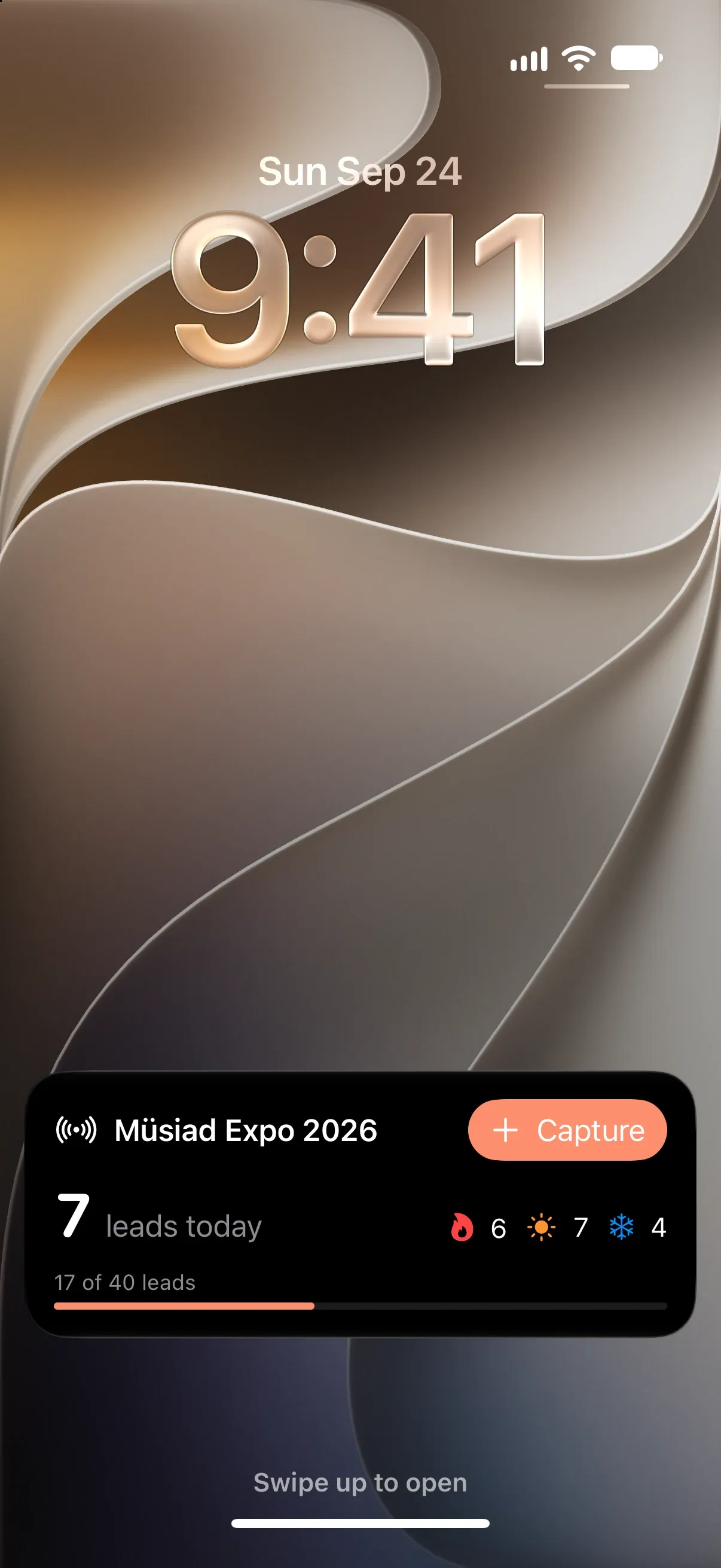 The Live Activity on the iPhone lock screen: Müsiad Expo 2026, 7 leads today; 6 hot, 7 warm, 4 cold and a Capture button